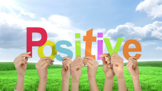 Hands holding up positive