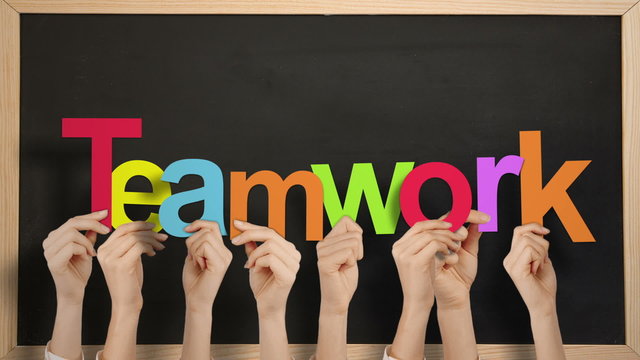 Hands holding up teamwork