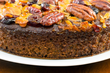 Pecan cake made with sliced almonds and dried cranberries 