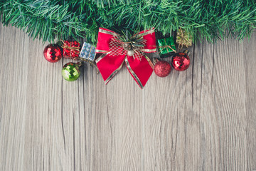 Fototapeta na wymiar christmas gift boxes and balls background on wooden texture