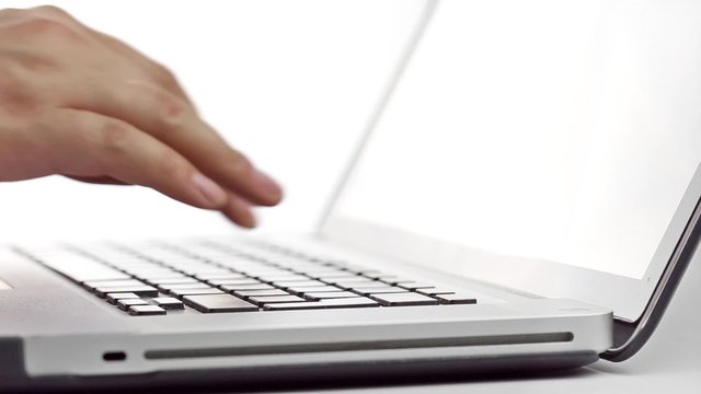 Fingers typing on a laptop Keyboard
