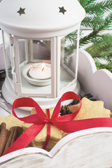 Candle Lantern, biscuits and Christmas decorations in wooden box