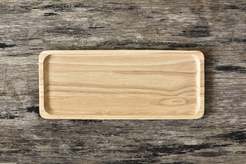 Wood plate on wood background