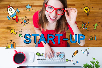 Start-up concept with young woman with red glasses