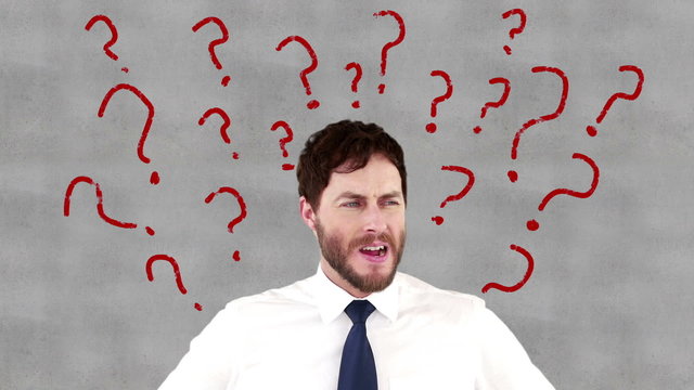 Stressed businessman with hands on head
