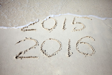 New Year 2016 replace 2015, concept on the sea beach