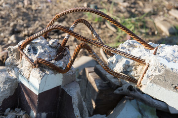 steel rusty rods in concrete. Damaged concrete pillar