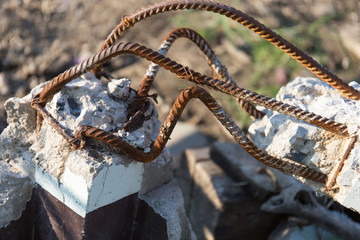 steel rusty rods in concrete. Damaged concrete pillar