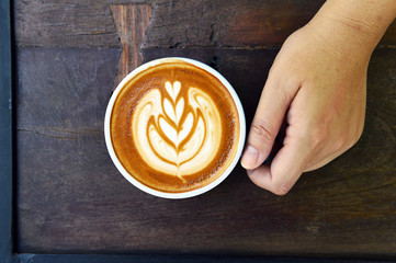 a cup of latte art coffee.