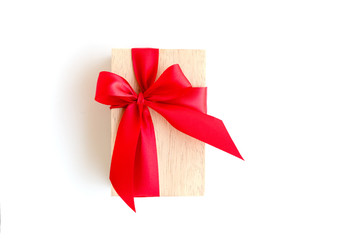 wooden box with red ribbon on white background with clipping pat