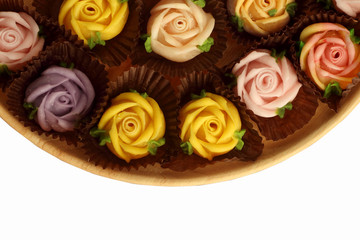 Allauch candy roses on a wooden floor white background