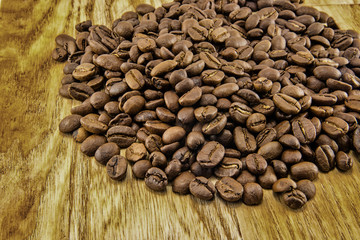Coffee beans on vintage wooden board
