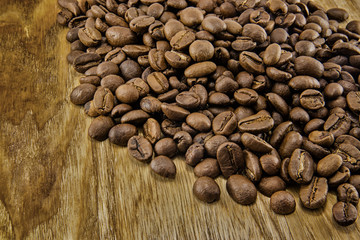 Coffee beans on vintage wooden board