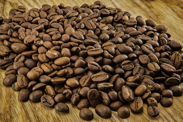 Coffee beans on vintage wooden board