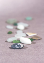 Colorful stones on the ground. This image shows that every individual is important for the whole team metaphorically speaking. Image has a vintage effect applied.