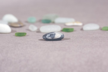 Colorful stones on the ground. This image shows that every individual is important for the whole team metaphorically speaking. Image has a vintage effect applied.