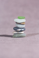 Colorful stones in a pile. This image shows that every individual is important for the whole team metaphorically speaking. Image has a vintage effect applied.