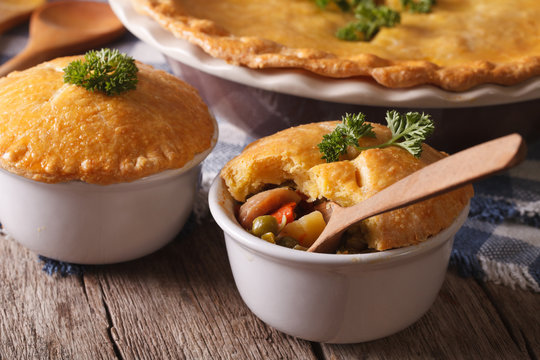 American cuisine: chicken pie with vegetables in a pot. Horizontal
