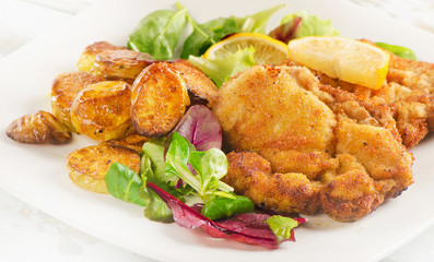 Homemade Breaded Schnitzel with Potatoes.