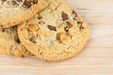Chocolate chip cookies on wooden table.