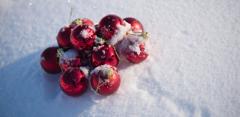 red christmas ball in fresh snow