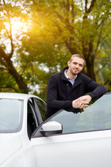 Man leaning on car door