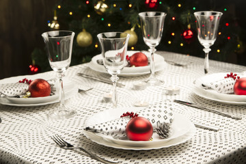 Christmas dinner table. Traditional Christmas decorations. Served table in a restaurant. Beautifully set table for Christmas Eve.