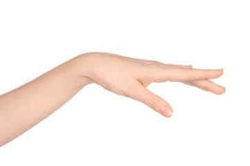 Beauty and Health theme: beautiful elegant female hand show gesture on an isolated white background in studio