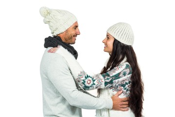 Smiling couple hugging and looking at each other