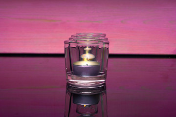 candles on a pink background
