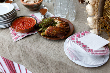 Delicious traditional wedding food close up, with ornaments and embroidery in the background