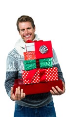 Festive man smiling and holding gifts