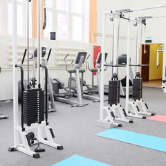Fototapeta na wymiar Gym centre interior. Equipment, gym apparatus.