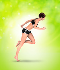 girl in racing position with green background