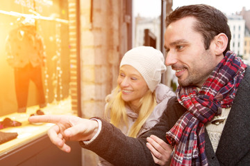 Young attractive couple doing some window shopping