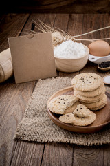 Rural vintage wooden kitchen table with old blank sheet of paper