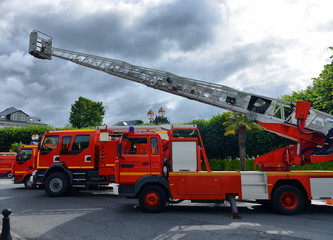 three fire trucks parked