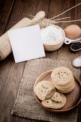 Rural vintage wooden kitchen table with old blank sheet of paper