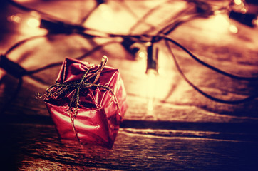 christmas light decor on wood background , color filter vintage tone