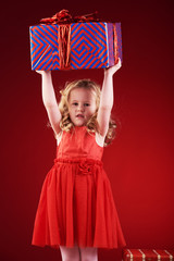Angelic little girl with blond wavy hair.