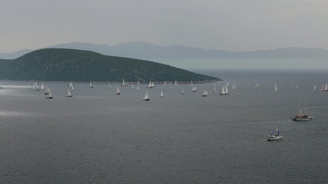 Boats sailing in a cloudy stormy day. Bodrum Cup 2015 regatta start. 4k