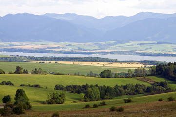 Fototapeta na wymiar Mountain and lake in distance landscape