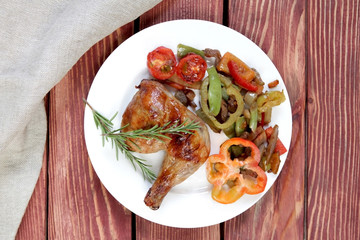  grilled chicken leg with rosemary and vegetables