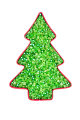christmas tree cookie cutter with green sprinkles