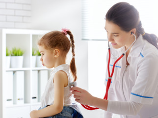 doctor examining a child