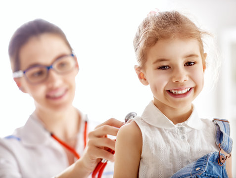 doctor examining a child