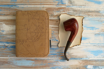 Smoking pipe and notebook