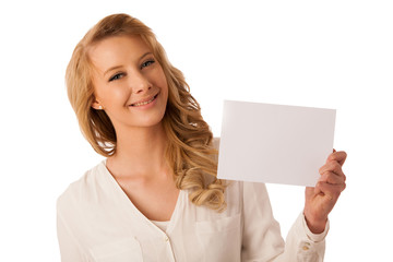 Fototapeta premium Beautiful young caucasian business woman holding a blank white b
