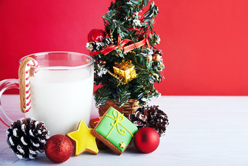 Christmas background with milk cookies and decorations.