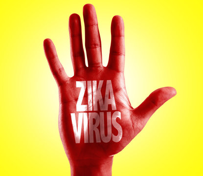 Zika Virus written on hand with yellow background